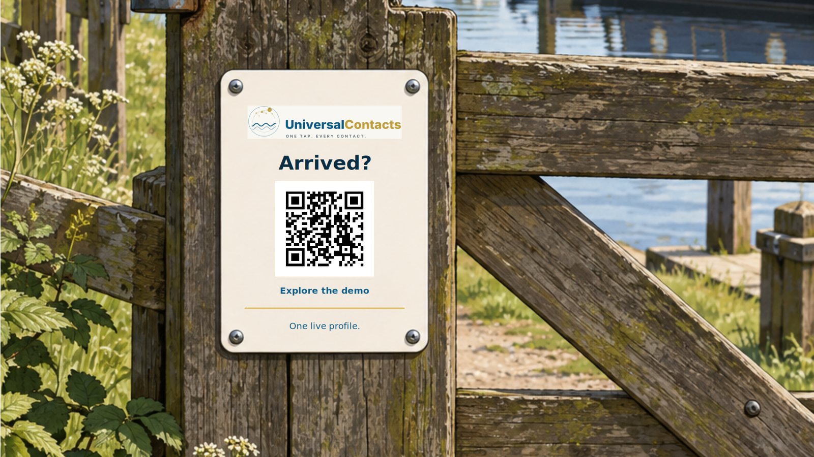 A metal sign bolted to a marina gatepost, its touchpoint facing the visitor, boats moored beyond.